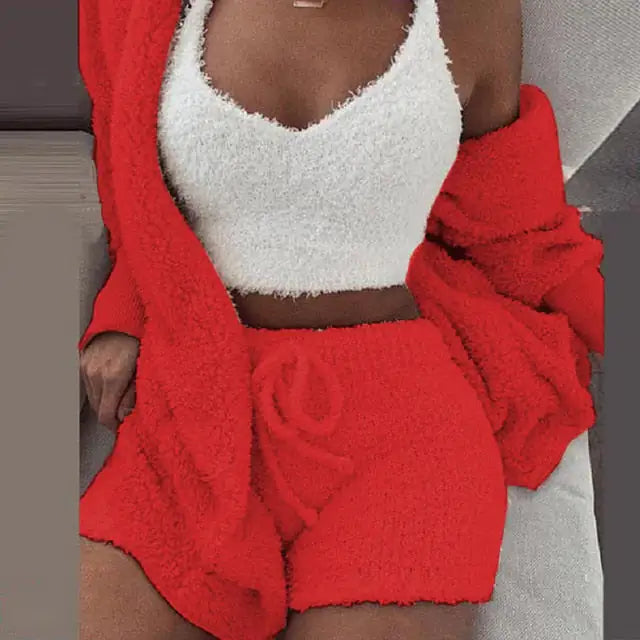 Adorable red knit set, a perfect gift for her. This stylish ensemble contains a cropped top, shorts, and a cardigan.