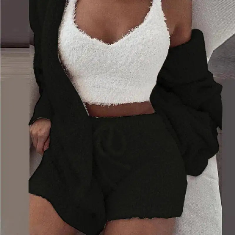 Elegant black 3-piece knit set, the perfect gift for her. Comprises a cozy cropped top, chic shorts, and a matching cardigan.