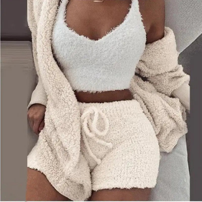 Chic 3-piece knit set in cream, an excellent gift for her. Includes a fuzzy tank, shorts, and a cozy cardigan.