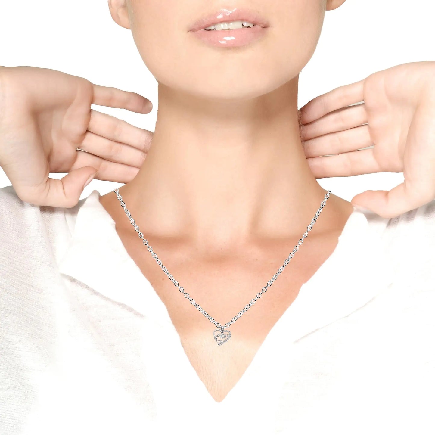 Woman wearing a delicate silver heart pendant necklace that reads 'Mom', highlighting it as an ideal gift for mom.